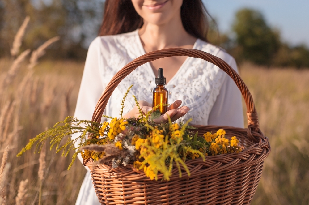 A,Woman,Collecting,Herbs,,Essential,Oil,,Bottle.,Herbal,Medicine,